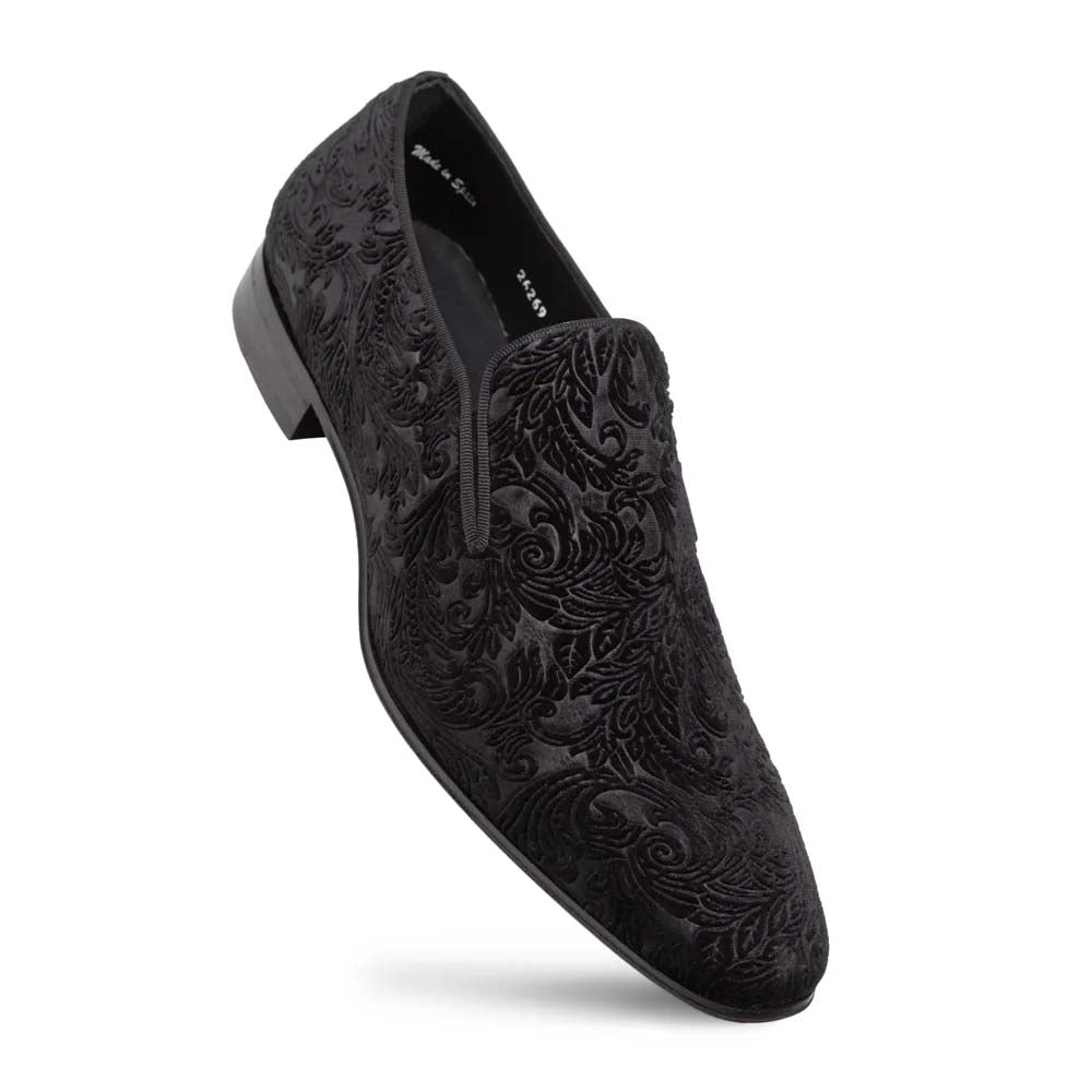 Mezlan Travolta loafer: Black velvet with embossed floral pattern. Elongated shape, slip-on design, and smooth, low heel. Formal style.
