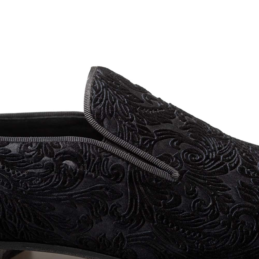 Mezlan Travolta loafer: Black velvet with embossed floral pattern. Sleek, rounded shape with a trimmed edge. Formal and elegant.
