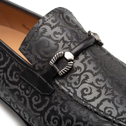 Mezlan Alcaraz slip-on with laser-printed pattern. Black leather upper, silver bit detail, and streamlined shape with a rounded toe. Easy slip-on style.
