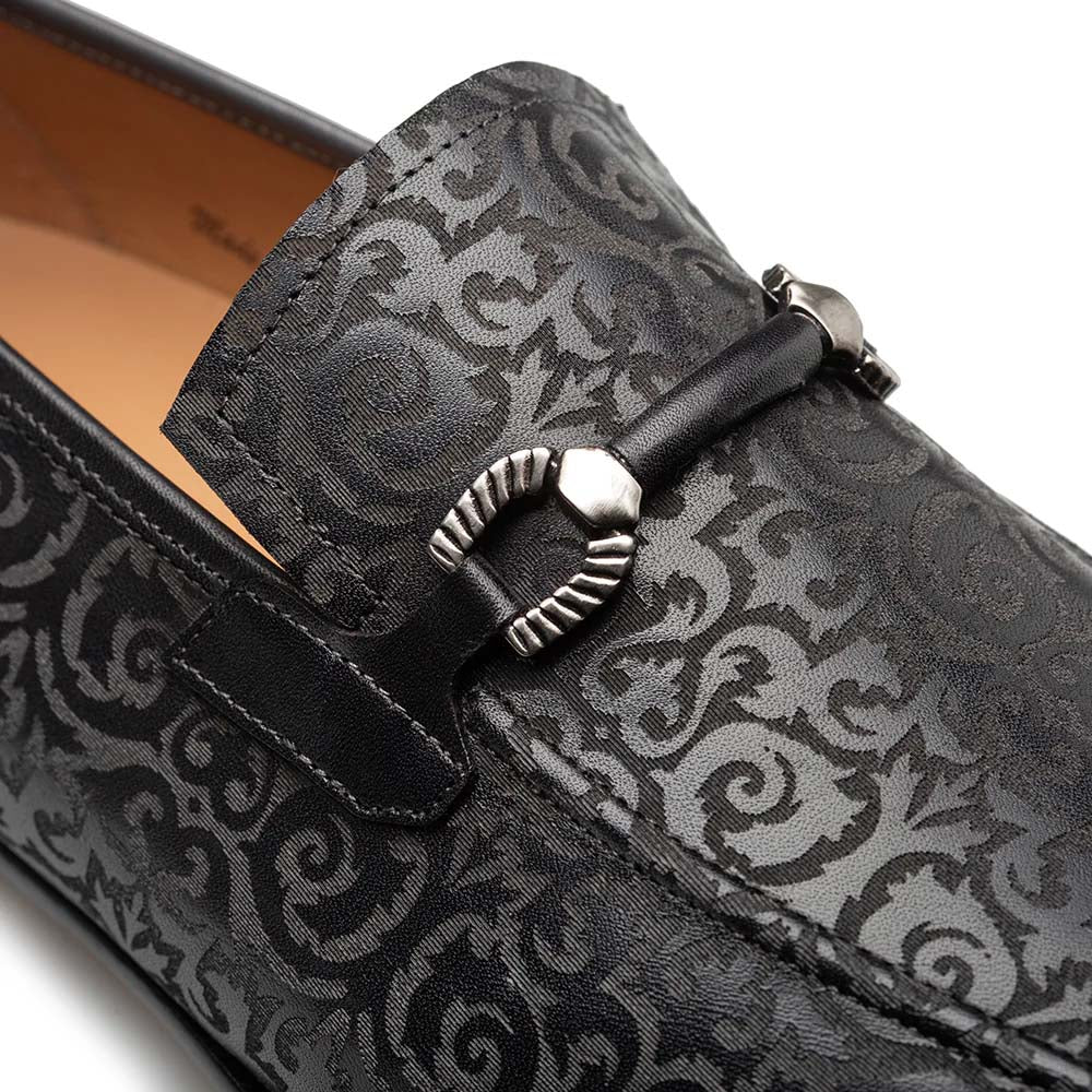Mezlan Alcaraz slip-on with laser-printed pattern. Black leather upper, silver bit detail, and streamlined shape with a rounded toe. Easy slip-on style.
