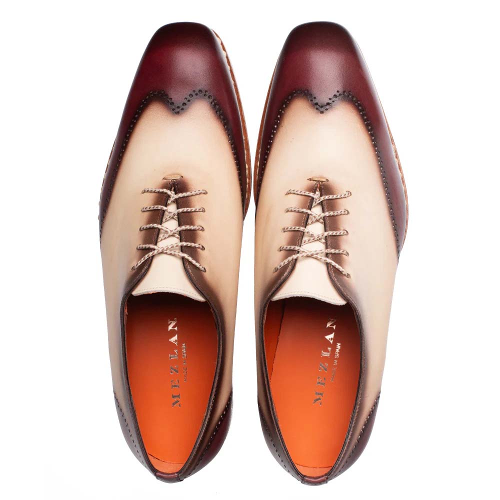 Mezlan Almagro Oxford: Two-tone leather (red/bone) with pointed toe and brogue detailing. Light brown laces and an orange interior lining.
