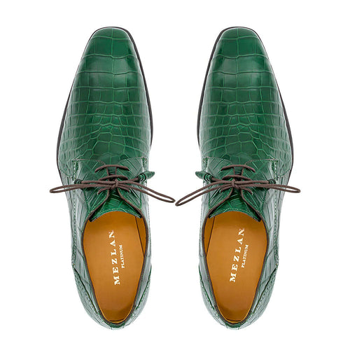 Forest green Mezlan Dandy lace-up shoes with alligator texture. Pointed toe, brown laces. Tan lining. A stylish blend of texture and color.
