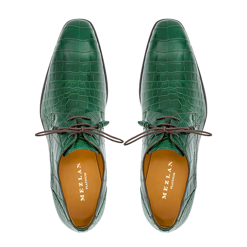 Forest green Mezlan Dandy lace-up shoes with alligator texture. Pointed toe, brown laces. Tan lining. A stylish blend of texture and color.
