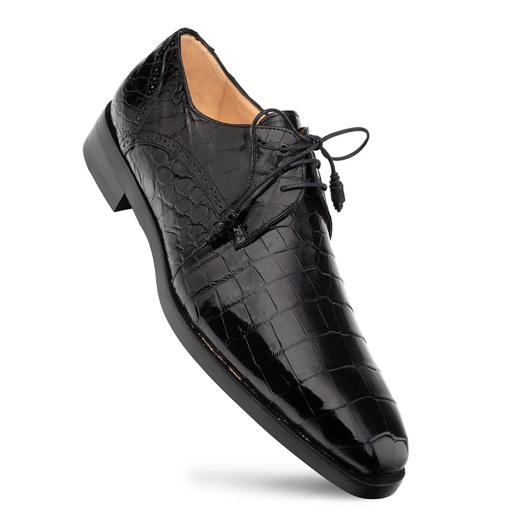 Black Mezlan Dandy alligator lace-up shoes. Sleek, pointed toe, structured upper, and black alligator leather with a scaly pattern. Features thin black laces, a smooth finish, and a low black sole.
