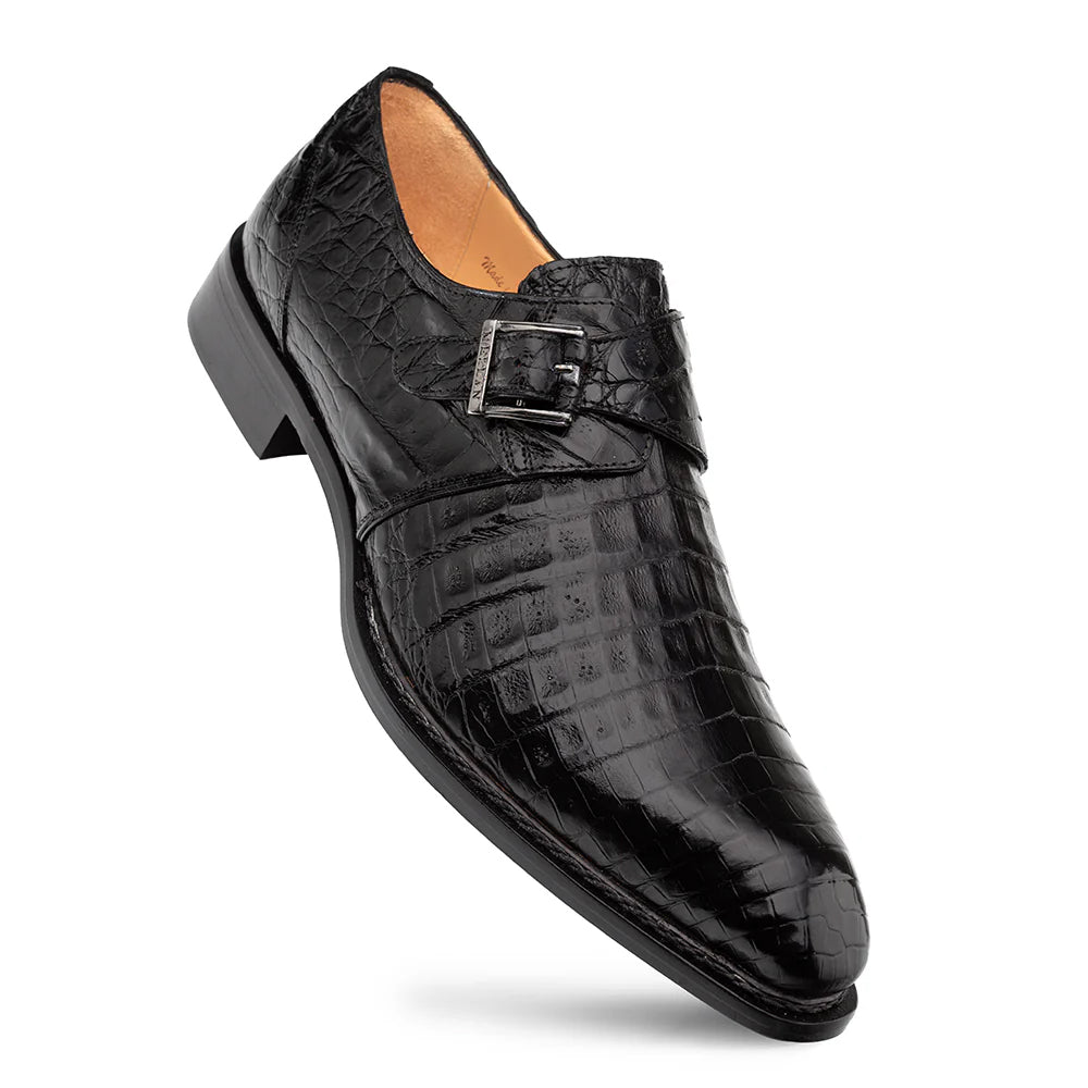 Mezlan Gigolo Monk Strap shoe in black crocodile. Elongated shape, pointed toe, single buckle. Textured leather, cushioned interior, and durable black outsole.
