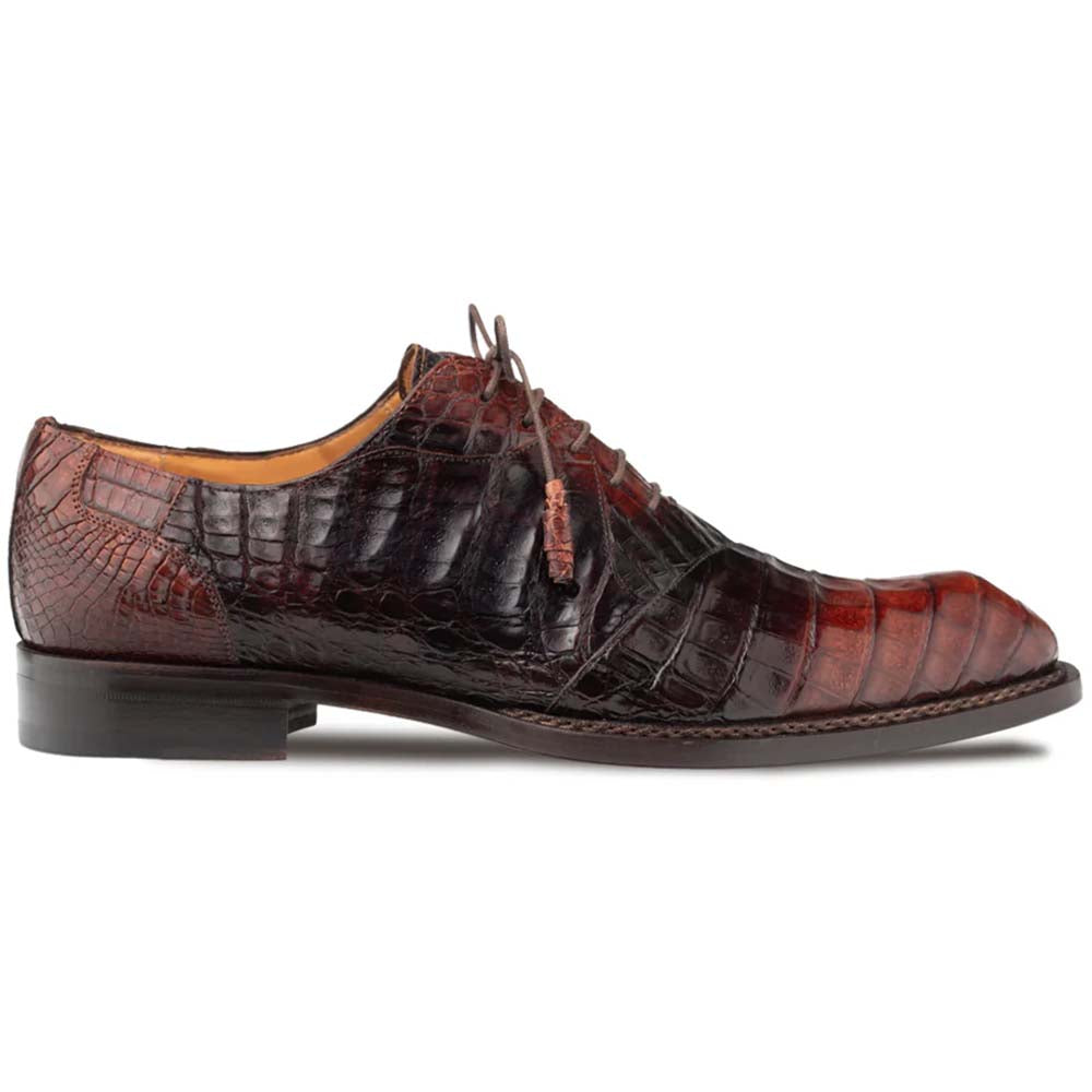 Mezlan Pueblo Oxford in chocolate crocodile. Sleek elongated shape, rounded toe, and glossy, textured scales. Deep chocolate brown with reddish undertones. Lace-up closure, stacked heel, and visible sole stitching for a seamless look.
