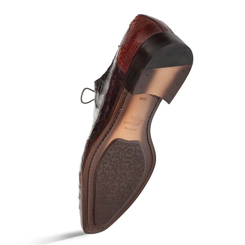 Mezlan Pueblo Oxford: Sleek, low-profile design. Chocolate crocodile leather with glossy finish. Pointed toe, lace closure. Stacked heel. Contrasting sole with intricate pattern for stability.
