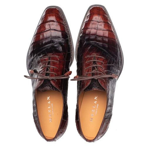 Mezlan Pueblo Oxford Sport crafted with contrasting chocolate crocodile leather. Pointed toe, glossy finish, and textured scale pattern. Lace-up closure with a light tan interior.
