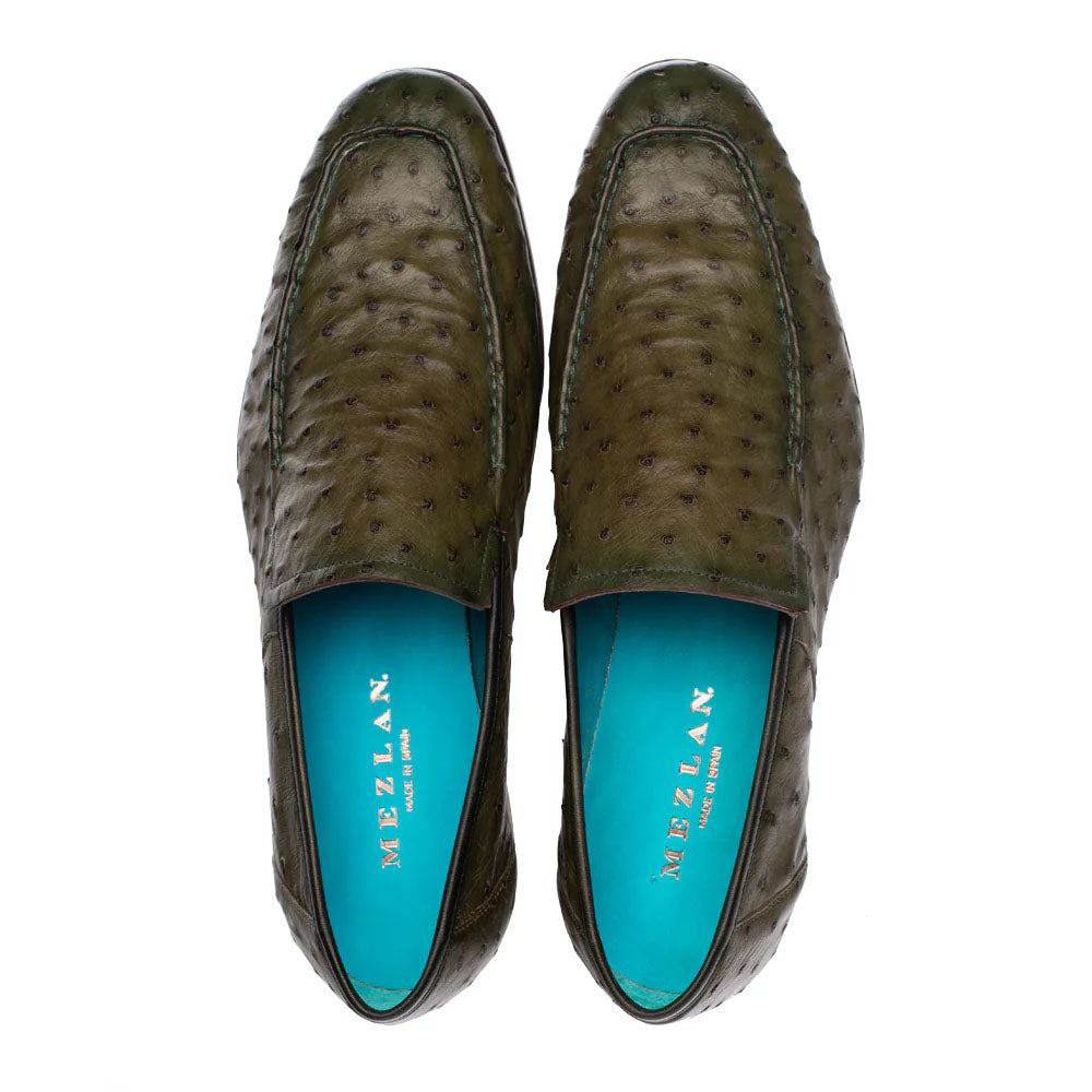 Olive green ostrich leather slip-on with elongated shape. Textured exterior, turquoise lining, and subtle stitching. Mezlan Menor style.
