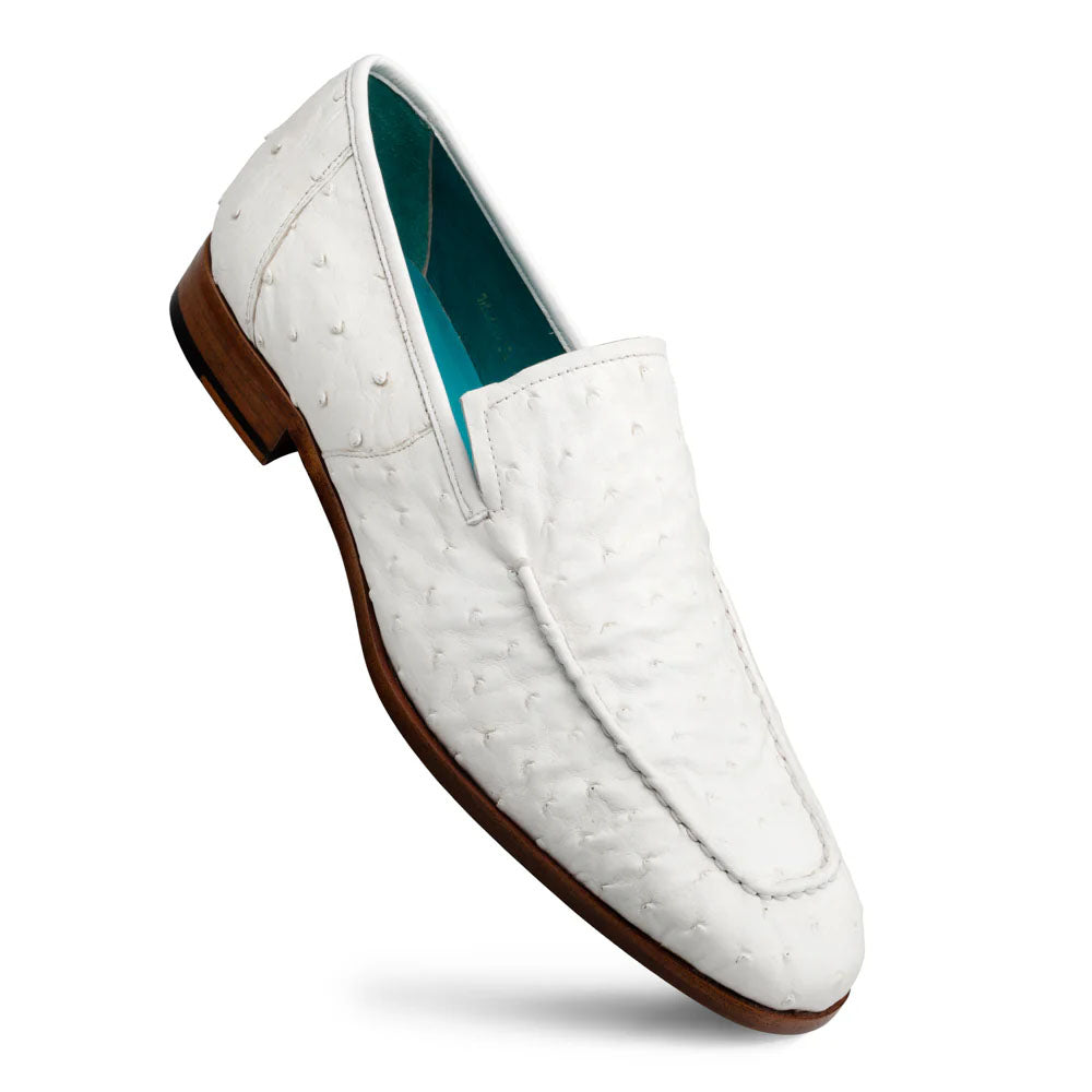 Mezlan Menor ostrich slip-on: sleek, elongated white ostrich leather upper with a slightly pointed toe. Turquoise lined interior, flat wooden sole with a heel. Single-piece design, simple stitching.
