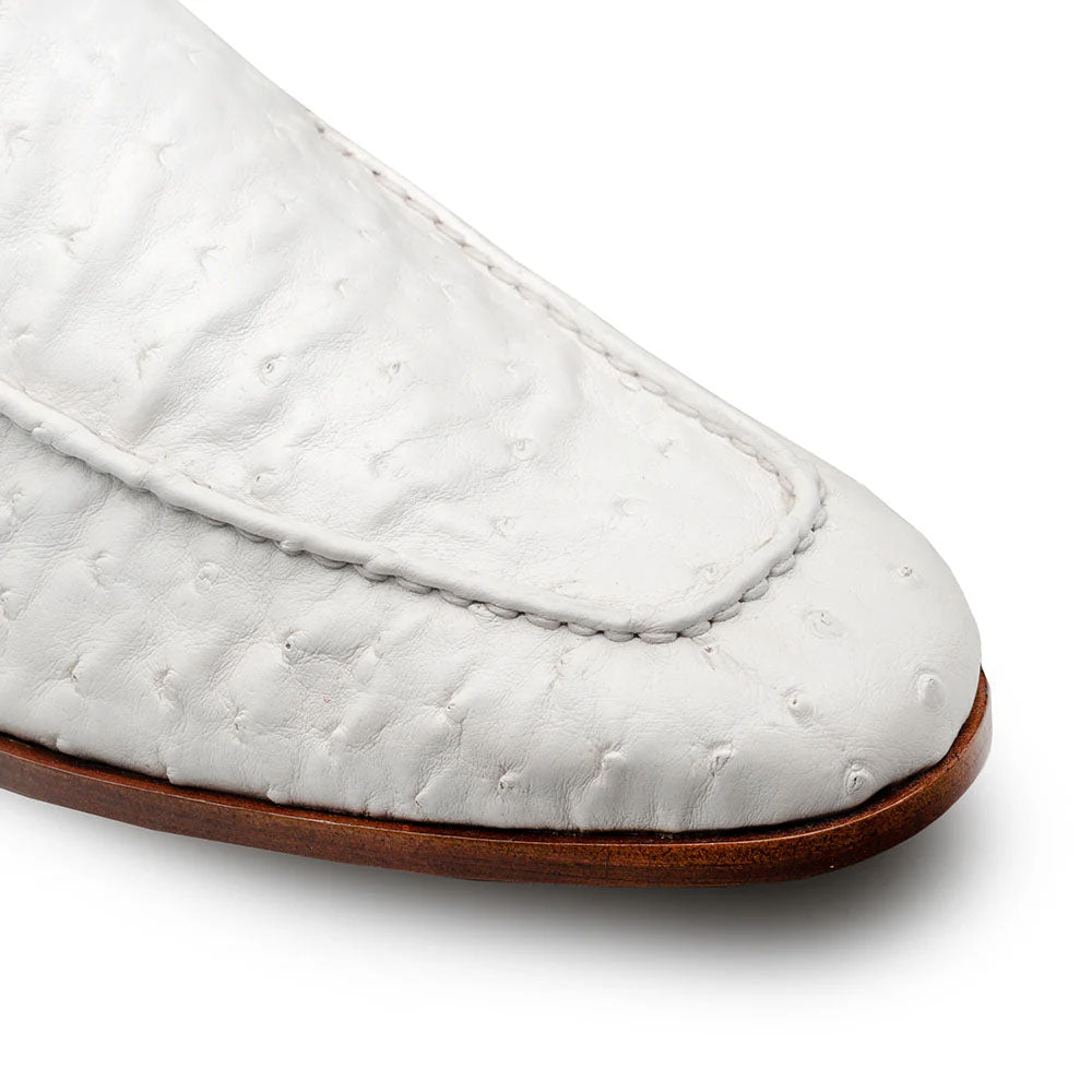 Mezlan Menor ostrich slip-on: White, textured ostrich leather with small bumps. Streamlined shape, rounded toe, stitched seam. Wooden sole for contrast.
