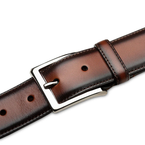 Cognac Mezlan belt crafted from smooth calfskin with a polished patina. Features a silver rectangular buckle and adjustable holes for a perfect fit. Classic and refined.
