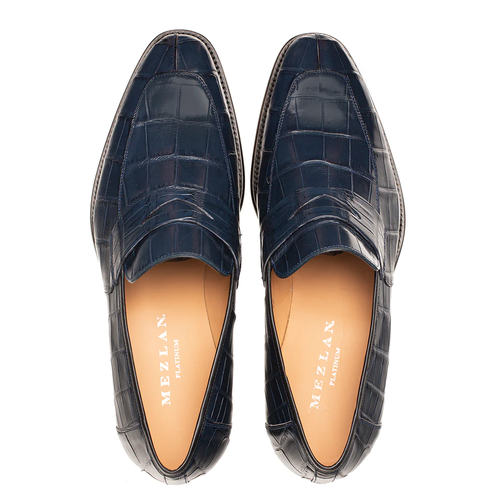 Blue Mezlan Piccolo Alligator Penny Loafer. Sleek, rounded design with smooth, embossed alligator leather upper. Tan leather lining and durable outsole.
