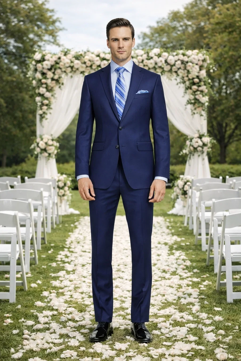 Dark blue, slim fit suit with modern styling. Two-button closure, notched lapel, and side pockets. Tailored silhouette for a sharp look.

