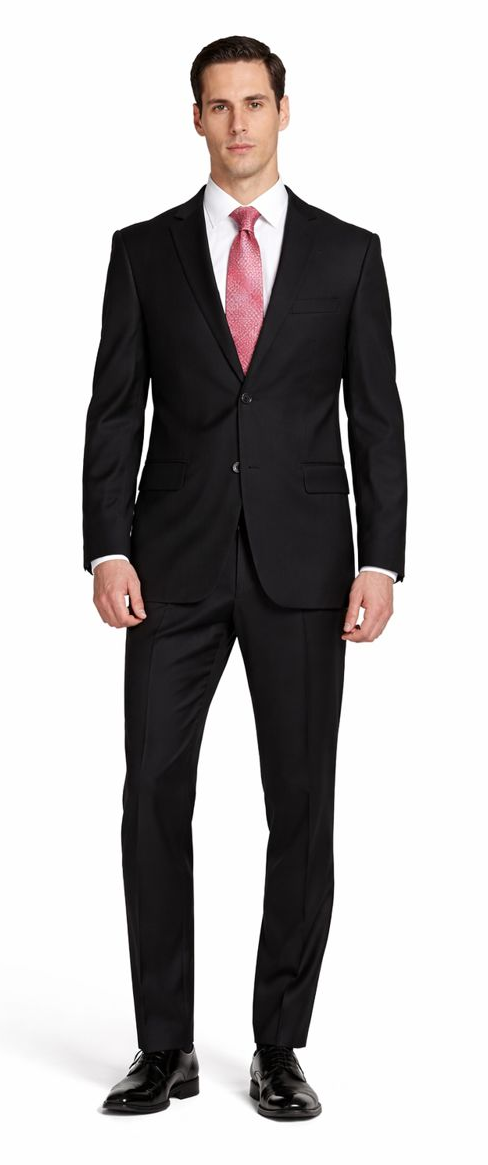 Mantoni black slim-fit suit: Single-breasted, two-button design. Smooth black fabric with notched lapels. Paired with a light shirt and pink tie, featuring two front pockets. Classic silhouette.
