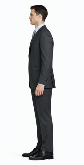 Mantoni gray suit: slim fit, two-button, smooth fabric. Features notched lapel, side pockets, single vent. Straight-cut trousers. Model wears a collared shirt. Solid gray color.
