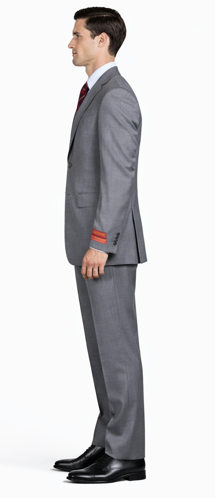 Mantoni gray super wool suit: tailored fit, single-breasted jacket with notch lapels and red cuff accents. Straight-leg trousers. Smooth gray wool fabric. Two front pockets, standard waistband.
