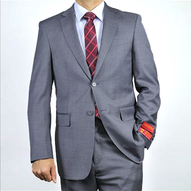 Mantoni gray super wool suit: fitted, notched lapel, textured fabric. Includes front/chest pockets, red cuff lining. Paired with white shirt, red checkered tie for a coordinated look.
