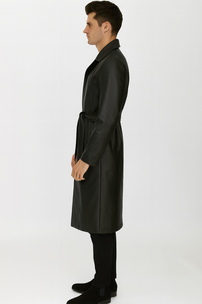 Men's black PU trench coat. Synthetic leather. Full-length, smooth, sleek. Belted waist, classic collar, long sleeves tapering at cuffs.
