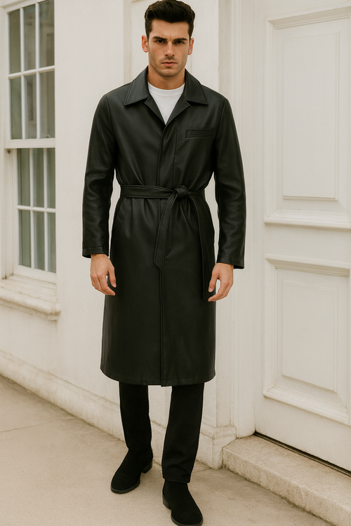 Men's long black PU trench coat with collar, front pocket, and waist belt. Full-length design in a leather-like material. Classic belted style.

