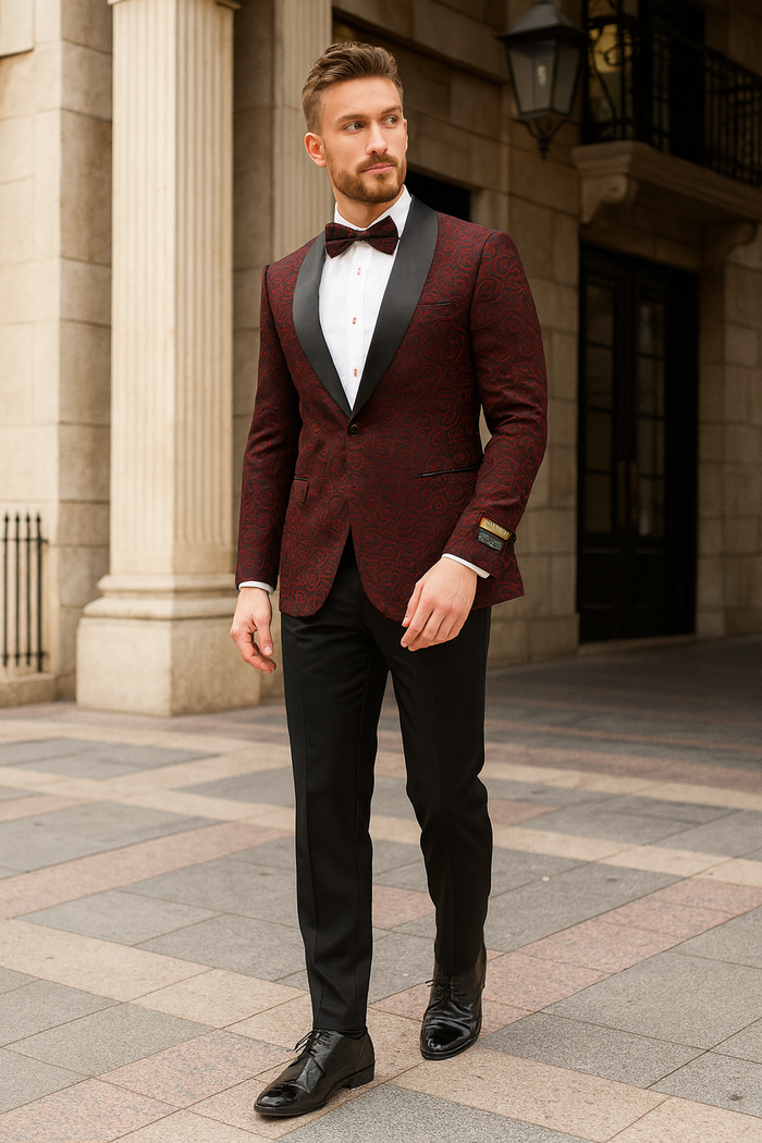 Burgundy paisley tuxedo jacket for men, slim fit with black satin lapel. Features burgundy paisley pattern, paired with a bowtie for a sophisticated look.
