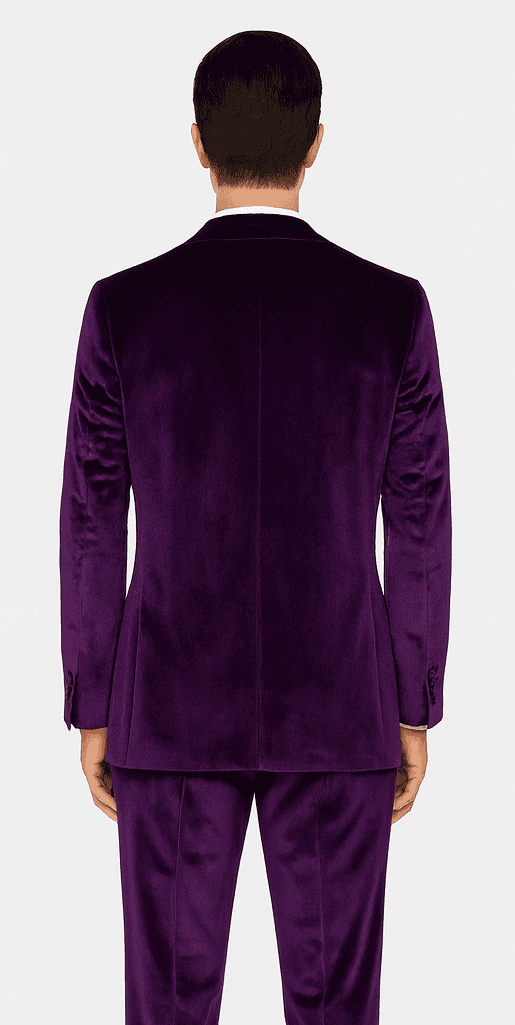 Purple velvet men's slim-fit suit. Two-piece tuxedo style: tailored jacket with notch lapel, matching trousers. Soft, luxurious velvet. Deep purple color, sleek silhouette.
