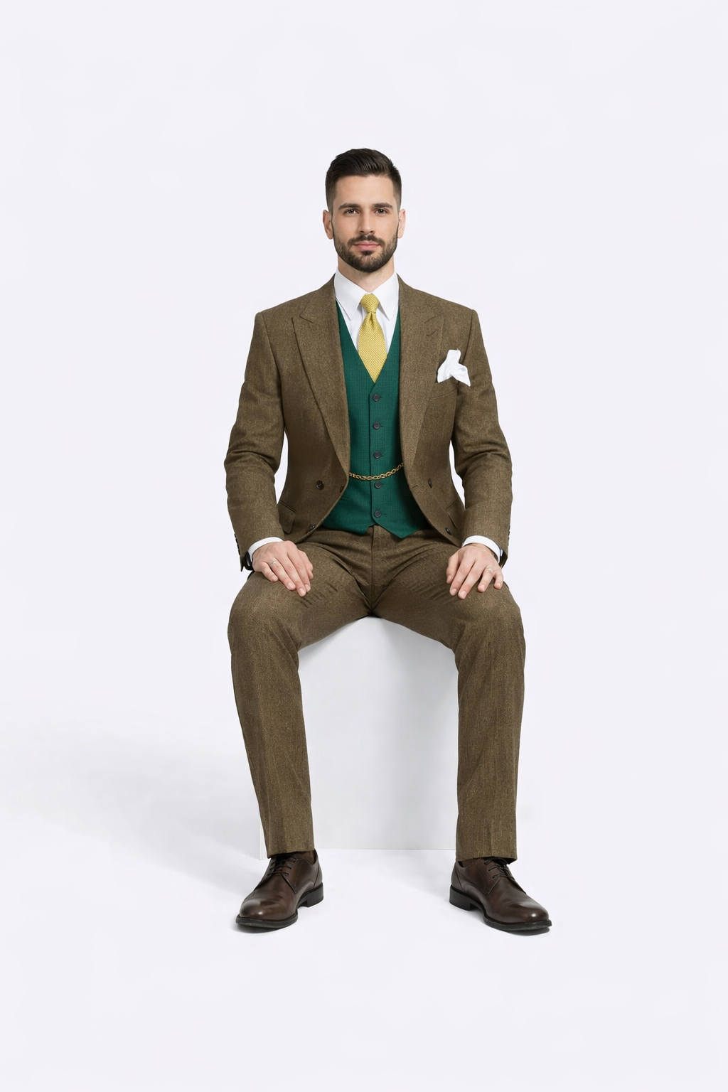 Brown double-breasted suit featuring a textured fabric with a herringbone pattern. The suit includes a matching pair of tailored trousers and is complemented by a waistcoat.