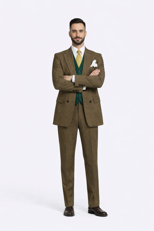 Brown, double-breasted suit made of a textured fabric. It features two front pockets and peaked lapels. The suit is tailored with a straight leg design.