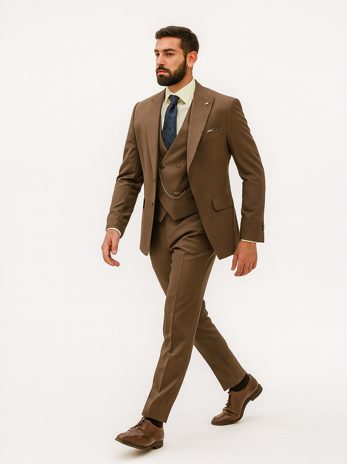 Tailored brown suit with vest. Smooth fabric, blazer, waistcoat & trousers in matching shade. Includes patterned tie & pocket square for a refined, cohesive look.
