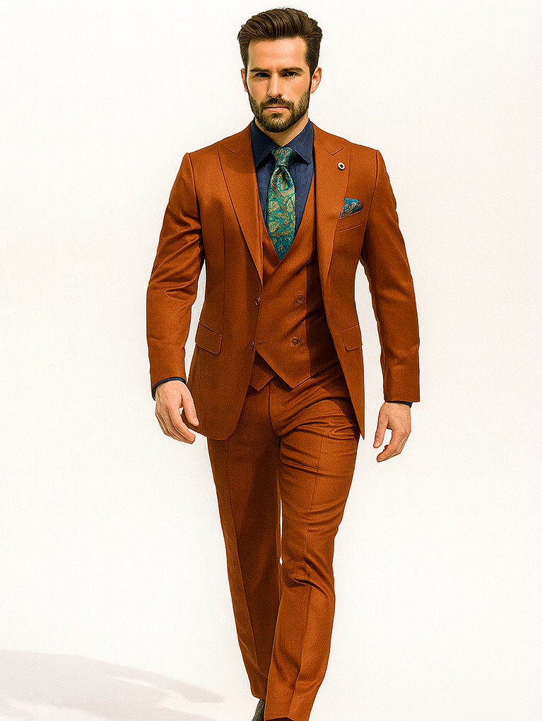 Luxury men's suit: orange jacket & trousers, fitted vest, navy shirt, patterned tie. Tailored shape, modern silhouette.
