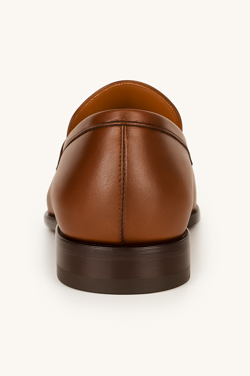 Mezlan Fabrizi penny loafer, rear view. Cognac calfskin leather upper, rounded heel, minimal stitching. Dark brown leather sole for a clean, streamlined silhouette.
