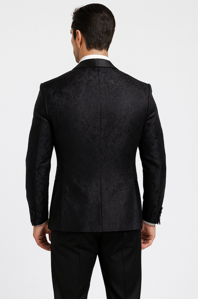Elegant black floral lace tuxedo. Fitted silhouette with a subtle sheen, pointed collar, and structured shoulders. Perfect for formal events.
