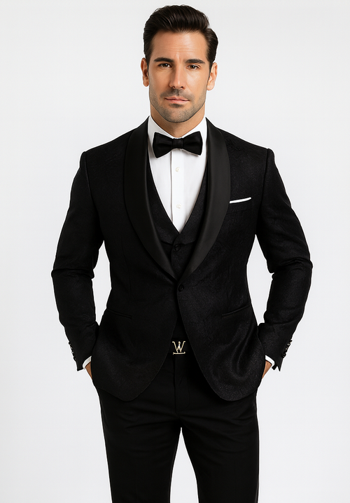 Black floral lace tuxedo. Fitted black jacket with satin lapels, matching vest, and trousers. Stylish formal wear in black.
