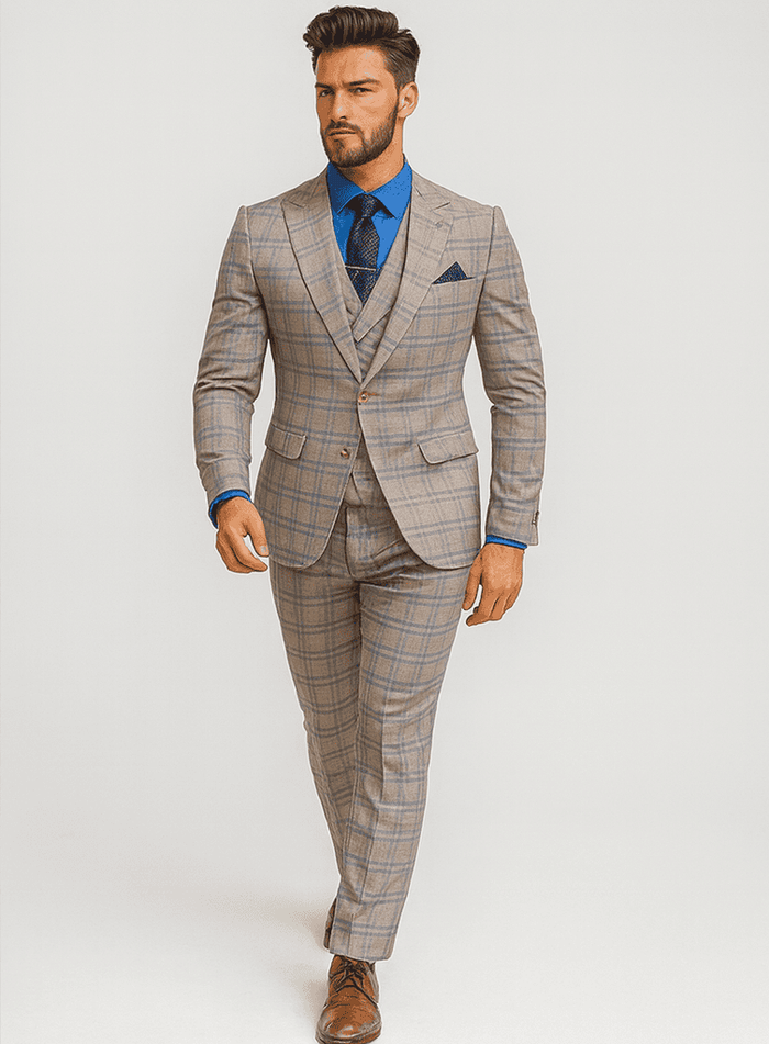 Elegant plaid suit with vest, featuring a fitted silhouette, gold buttons, and structured lapels. Light brown base with darker brown/blue check. Tapered trousers, precise fit. Formal and stylish.
