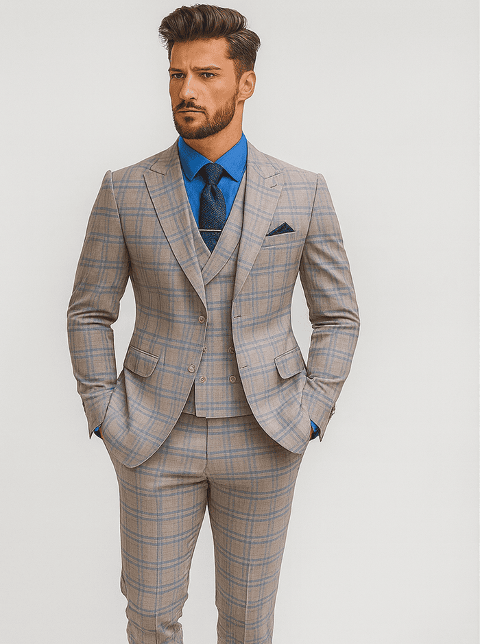 Beige plaid suit with blue check. Includes jacket, vest (with gold buttons), and fitted trousers. Classic tailored design for a polished look.
