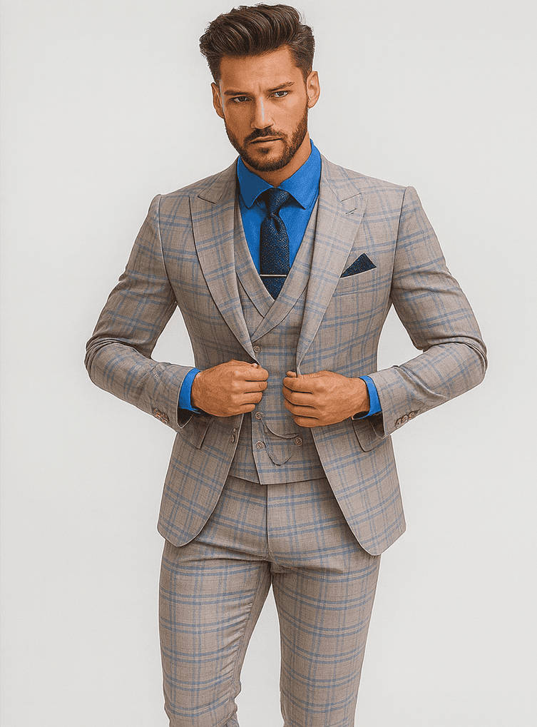Light gray plaid suit with fitted structure, natural shoulders, and double-breasted vest. Gold buttons and subtle check pattern. Paired with a solid blue shirt.
