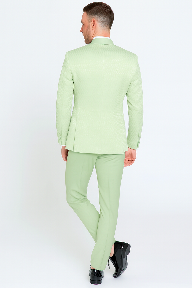 Mint green slim-fit tuxedo suit with shawl lapel and textured fabric. Includes matching light green bow tie. Tailored pants complete the elegant look.
