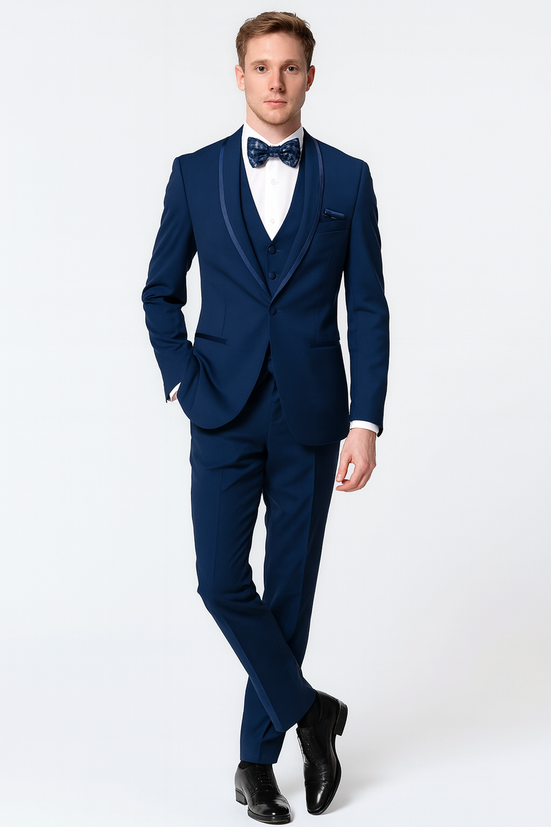 Navy three-piece tuxedo with satin shawl lapel & blue trim. Includes matching bow tie, white shirt & fitted silhouette. Finished with polished black shoes.
