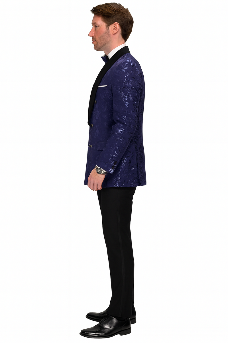 Navy floral jacquard tuxedo jacket. Double-breasted, black shawl lapel. Textured navy floral pattern. Tailored fit with flap pockets & silver buttons.
