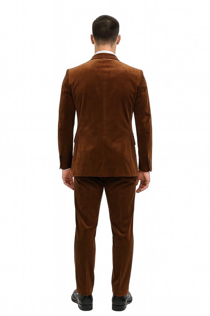 Men's brown velvet two-piece suit. Slim-fit formal blazer and pants set in rust copper. Smooth texture, tailored shape visible from the back.
