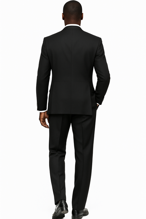 Black wool three-piece suit. Wide-leg baggy pants, double-breasted vest with peak lapel, structured back. Matching trousers. Classic tailoring.
