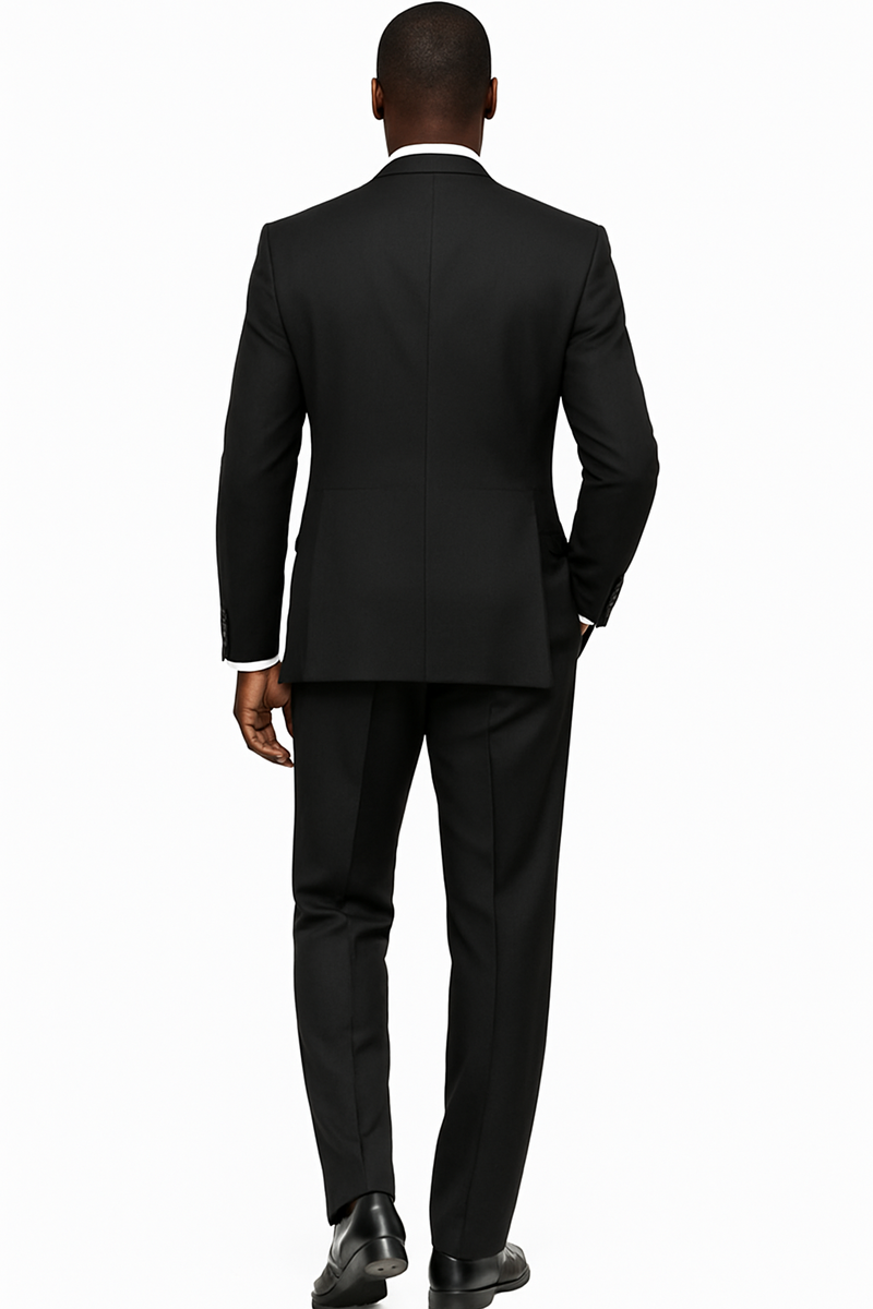 Black wool three-piece suit. Wide-leg baggy pants, double-breasted vest with peak lapel, structured back. Matching trousers. Classic tailoring.
