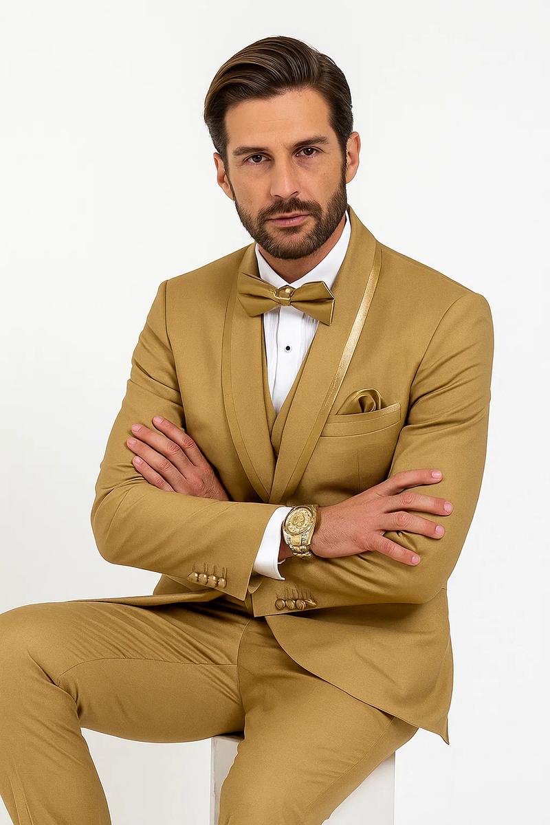 Men's gold champagne tuxedo with satin shawl collar, single-breasted jacket, slim-fit trousers, and vest. Includes a matching bow tie and white dress shirt.
