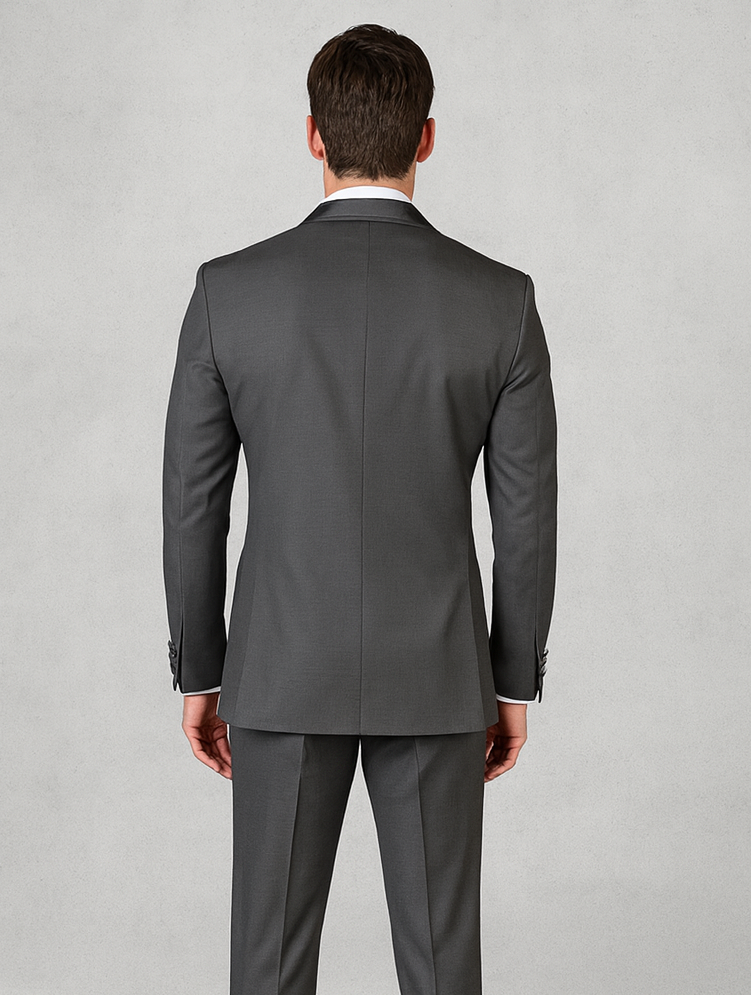 Men's charcoal gray tuxedo suit with satin shawl collar. Fitted cut, long sleeves, single vent. Smooth satin fabric with an integrated vest for a formal look.
