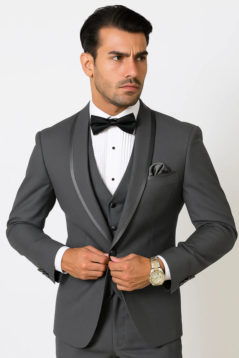 Charcoal satin tuxedo suit with shawl collar, vested. Single-breasted jacket, charcoal color, paired with a vest. Includes white pleated dress shirt, black bow tie, and matching pocket square.
