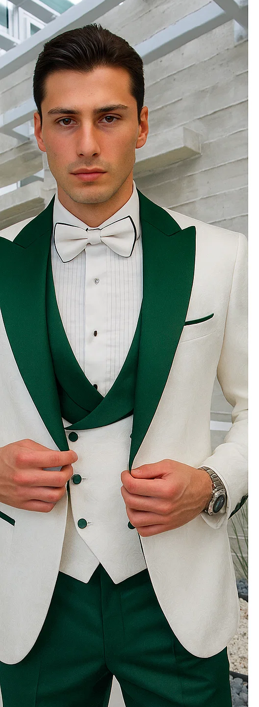 Men's tuxedo: White paisley jacket with green shawl collar, paired with hunter green pants. Includes a white pleated shirt and matching green vest. A coordinated formal look.

