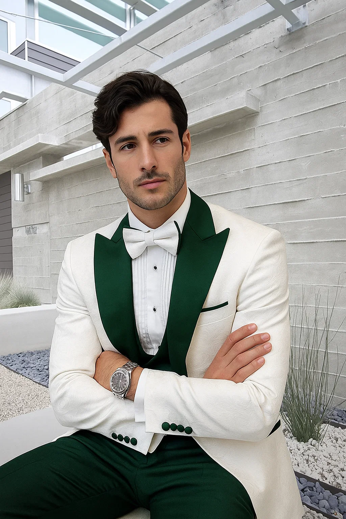 Men's tuxedo: white paisley jacket, hunter green pants. Structured jacket with shawl lapels, dark green accents. Fitted, tailored pants. Formal style, subtle paisley on white, smooth green.
