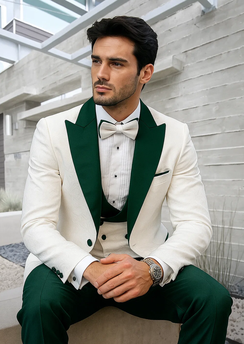 Men's tuxedo: White paisley jacket (structured fit) with hunter green shawl collar & buttons. Black vest, pleated white shirt. Hunter green trousers. White bow tie.
