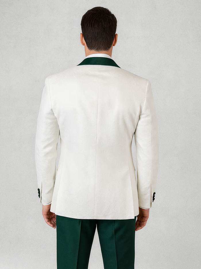 White paisley tuxedo jacket with a structured fit, green collar, and black buttons. Paired with tailored hunter green pants.
