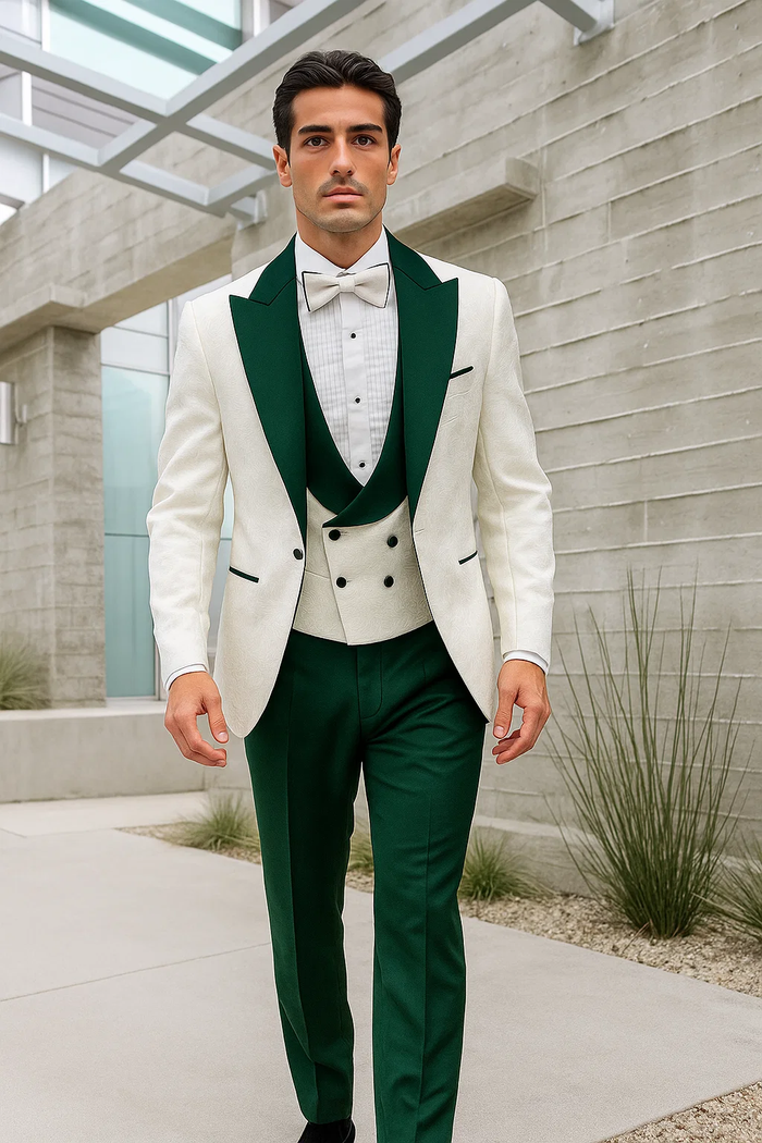 Men's paisley tuxedo: white jacket with structured shape, green collar, and double-breasted vest. Hunter green pants, white shirt, and bow tie complete the formal look.
